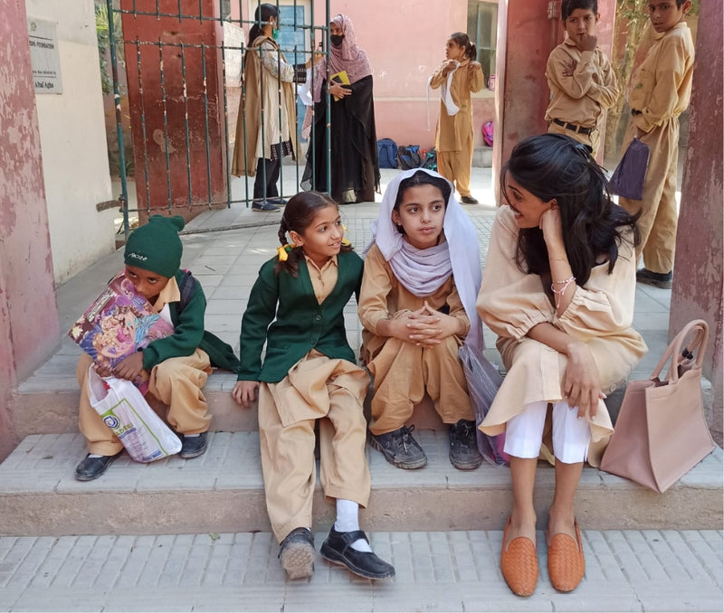 Makeup Artist Fizah Pasha with children of TCF Charity